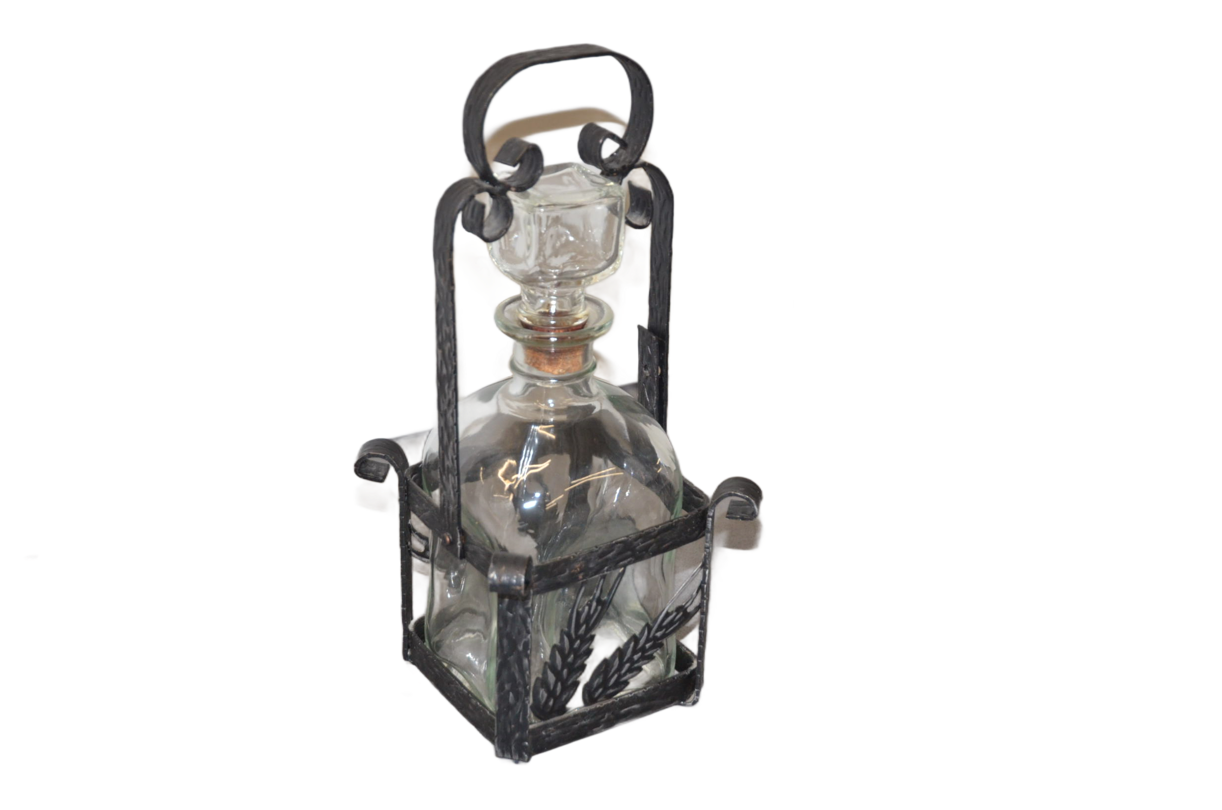 Glass decanter with metal frame